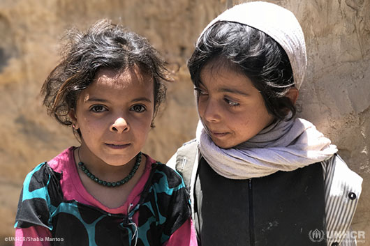 Three-year-old Susan and five-year-old Khadija play in antiquated buildings in Amran's Old City as their families struggle to cope with the effects of Yemen's continuing violence and deteriorating conditions.