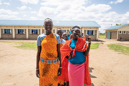 Two smiling girls at Tumaini Girls Secondary School at the Kakuma Refugee Camp in Kenya