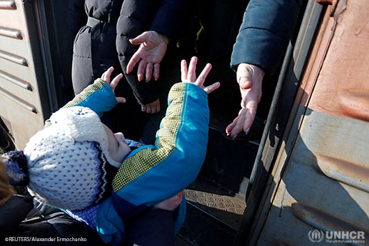 Ukraine. Evacuees board a train at a railway station before leaving Makiivka.