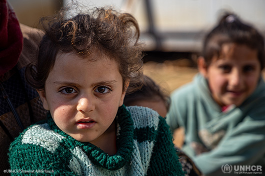 A young Syrian girl looking into the camera
