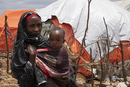 A displaced Somalian mother with her young child