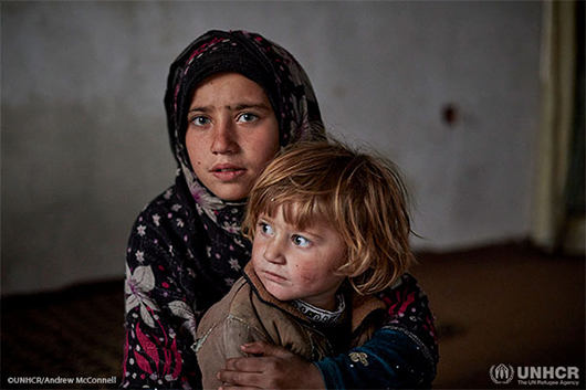 Nine-year-old Fauzia* and her three-year-old sister Aseela* in their temporary accommodation in Kabul.